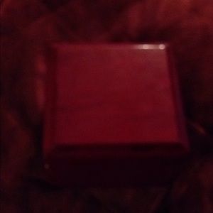 Cherry wood hinged watch box with leather pillow.
